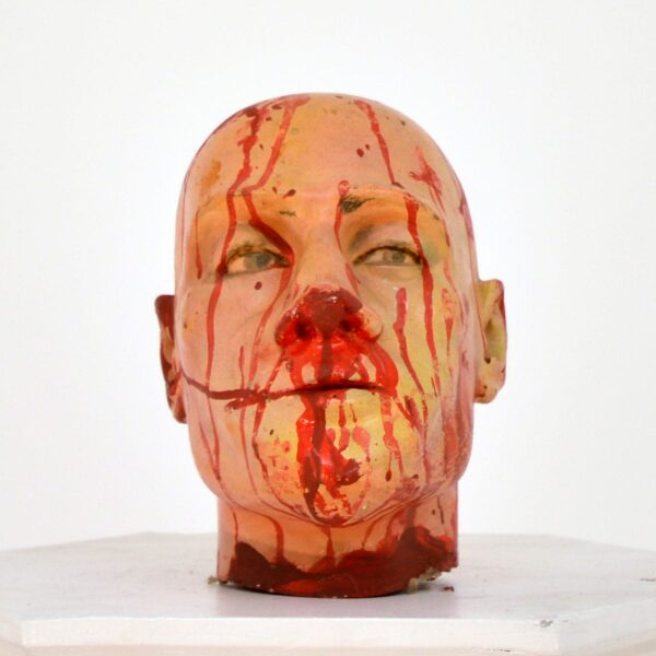 Horror severed head with blood splatters