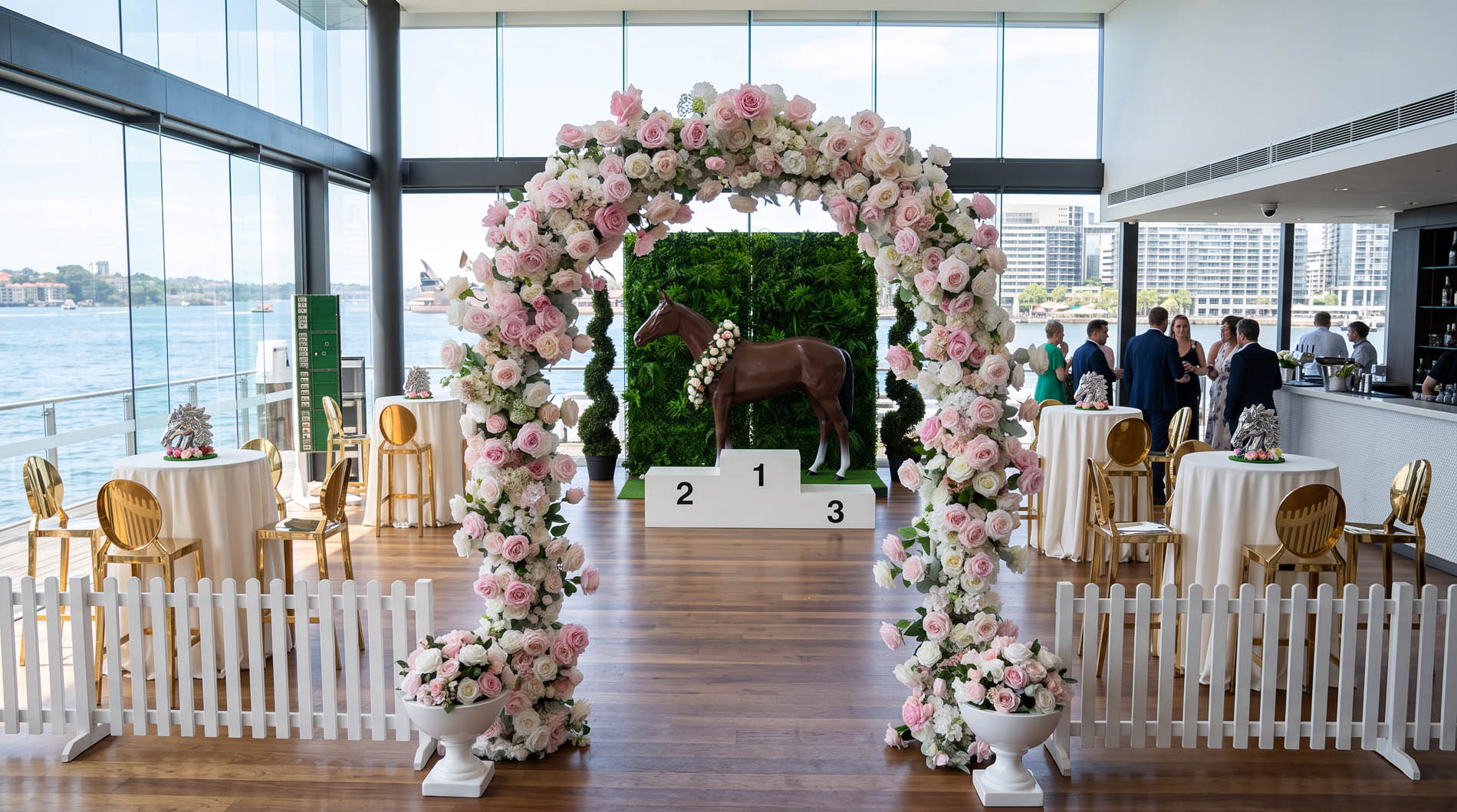 The Winners Circle Package — floral arch, winners' podium and race-day styling with harbour views